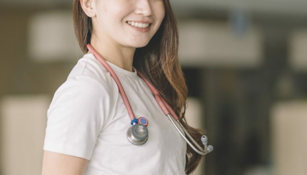 a portrait of medical healthcare worker in front of the entrance hall lobby corridor of hospital